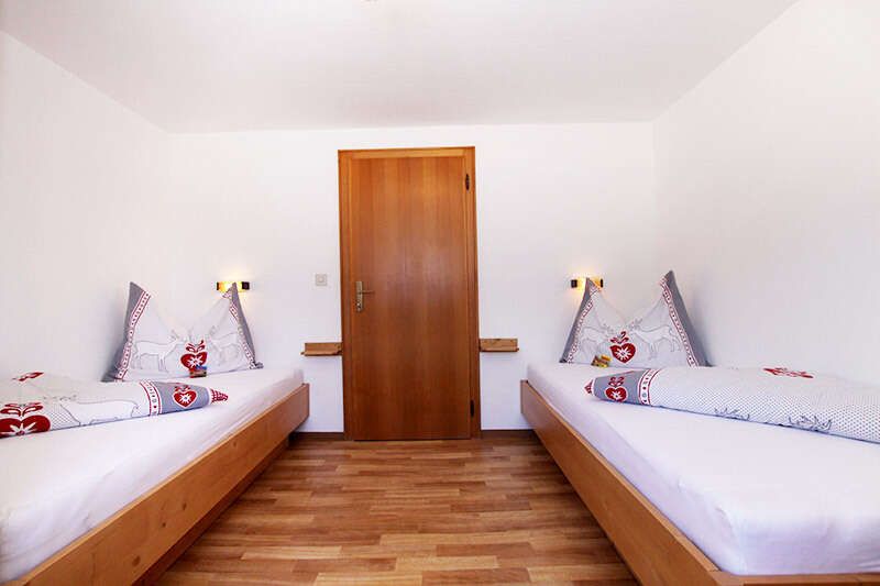 Two single beds in the family room in the Pfandhof